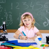 littlegirlatschoolclassroomwithmicroscope_6218758_original